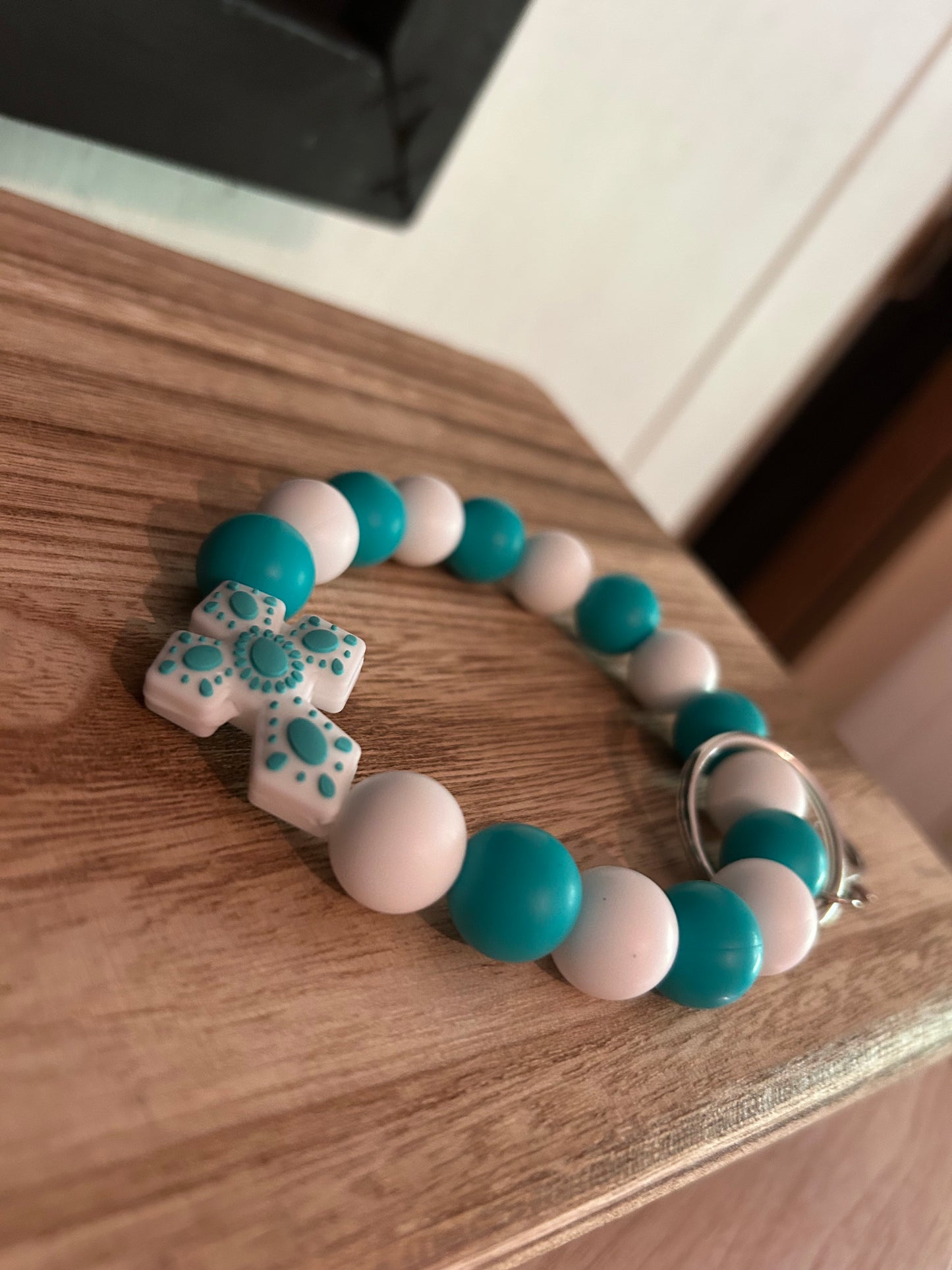 Teal and white cross wristlet keychain