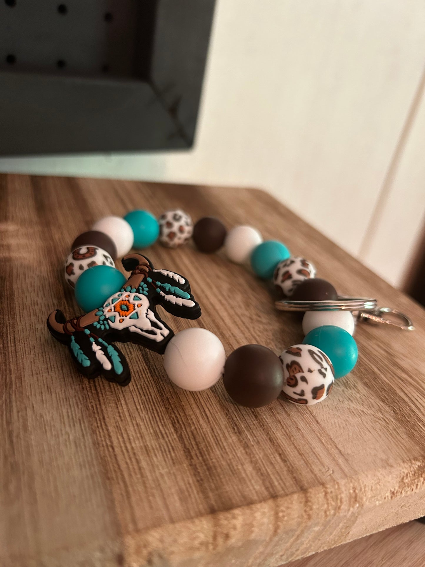 Turquoise and brow cow print with cow skull wristlet keychain